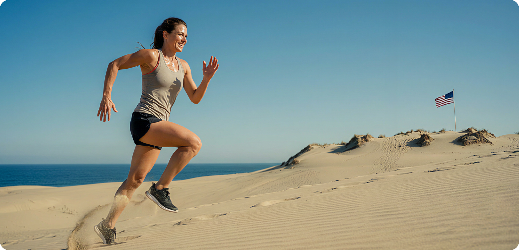 Active woman running on beach — healthy lifestyle